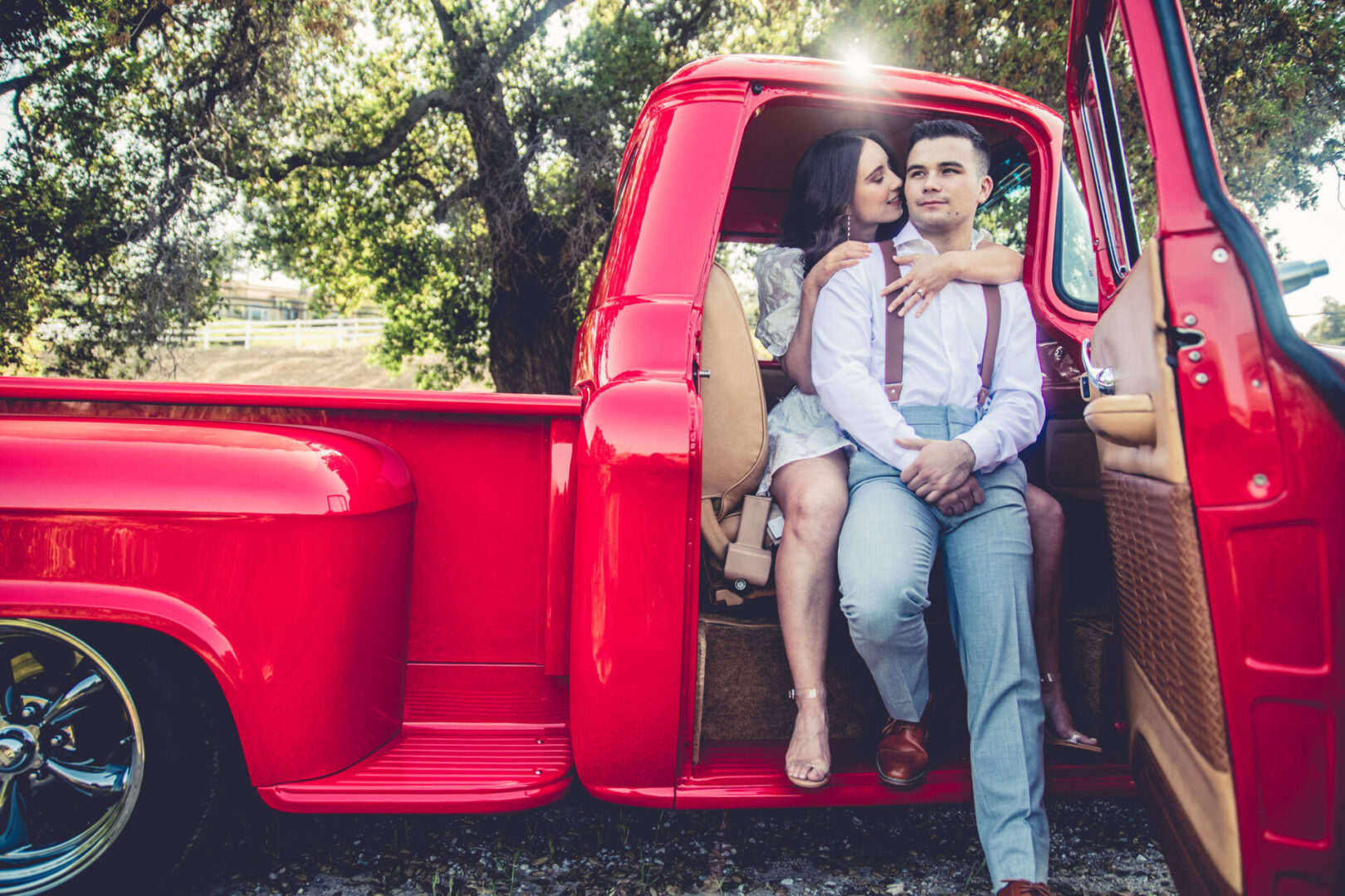 fun engagement portrait session with a red vintage truck 